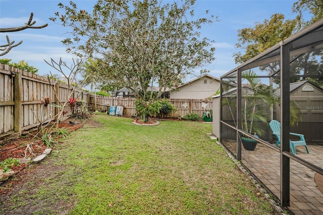 view of yard featuring glass enclosure