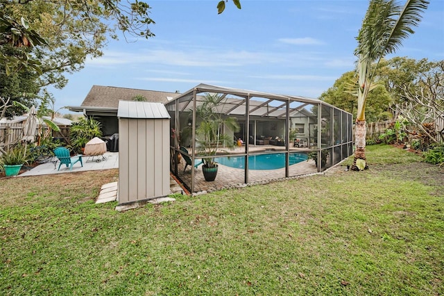 view of pool featuring a lanai, a lawn, and a patio area