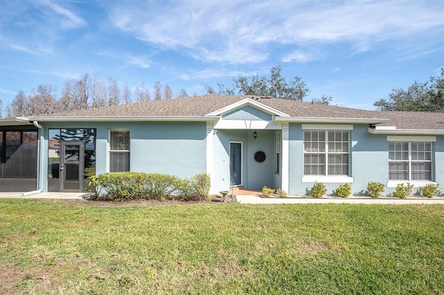 ranch-style home with a front lawn