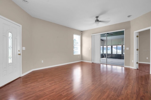 spare room featuring wood-type flooring and ceiling fan