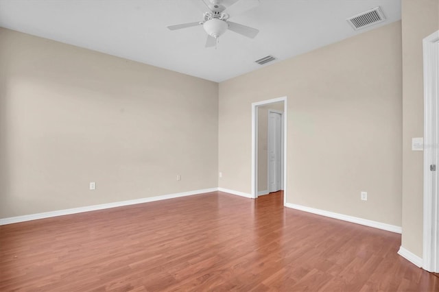 empty room featuring ceiling fan and wood-type flooring