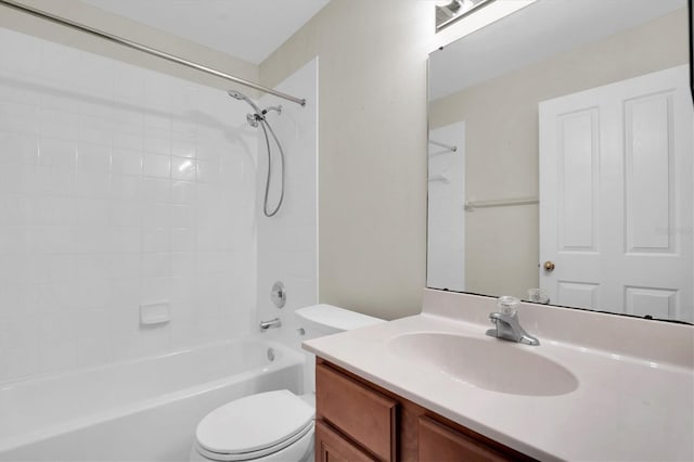 full bathroom with vanity, toilet, and tiled shower / bath combo