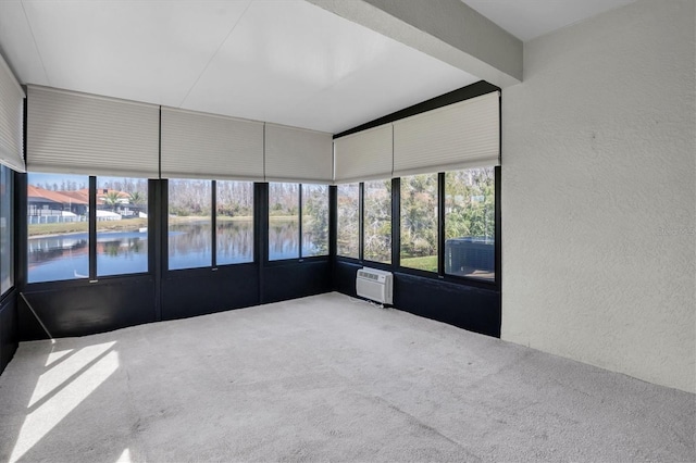 unfurnished sunroom with a water view