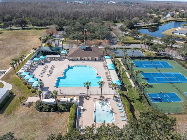 birds eye view of property with a water view