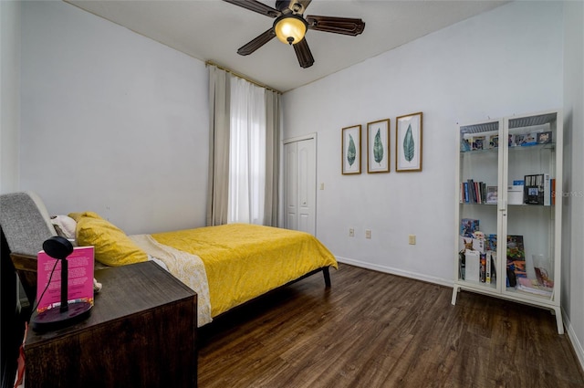 bedroom featuring a closet, dark hardwood / wood-style floors, and ceiling fan