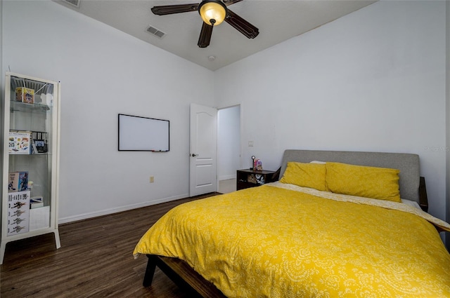 bedroom with ceiling fan and dark hardwood / wood-style flooring