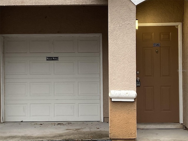 property entrance featuring a garage