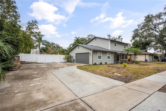 view of front of home featuring a garage and a front yard