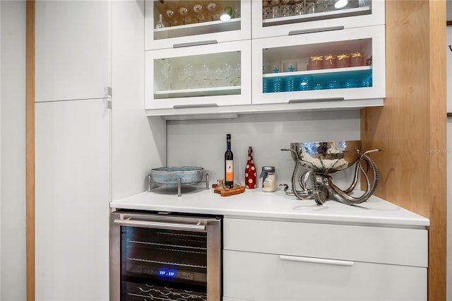 bar featuring white cabinets and wine cooler