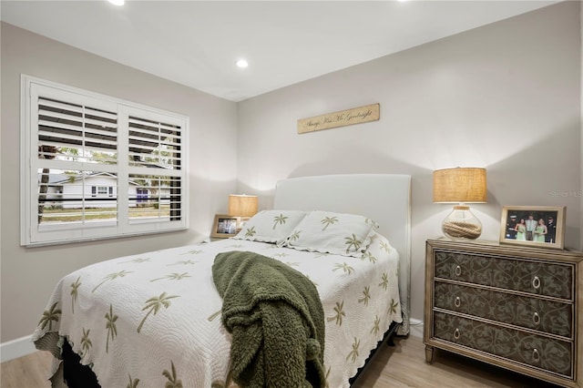 bedroom with wood-type flooring