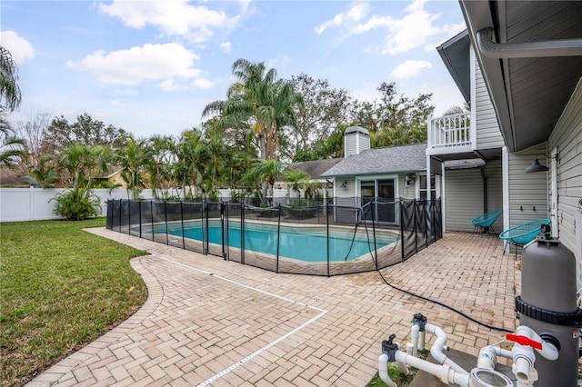 view of swimming pool featuring a yard and a patio area