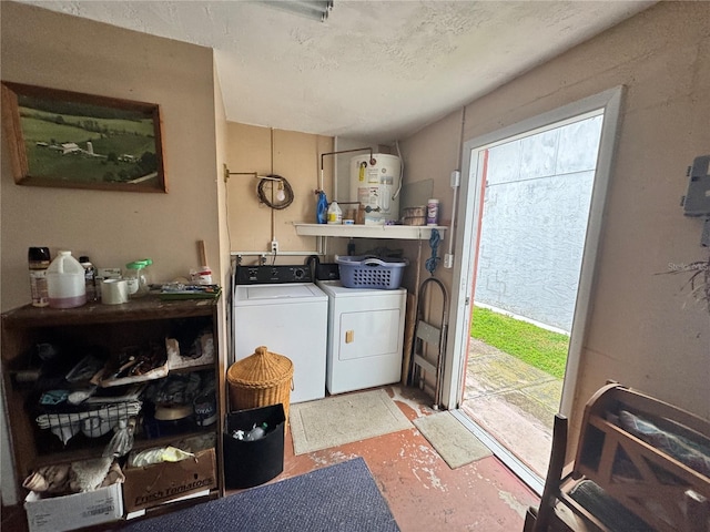 laundry room with washer and clothes dryer, water heater, and a textured ceiling