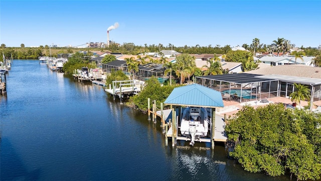 dock area featuring a water view and glass enclosure