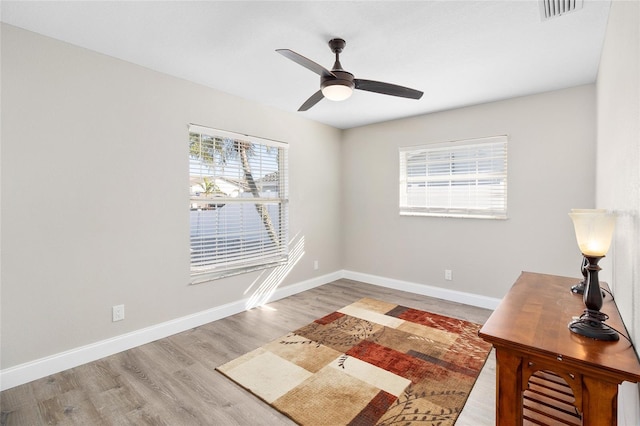 interior space with ceiling fan and light wood-type flooring