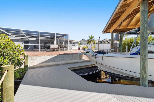 view of dock with a lanai