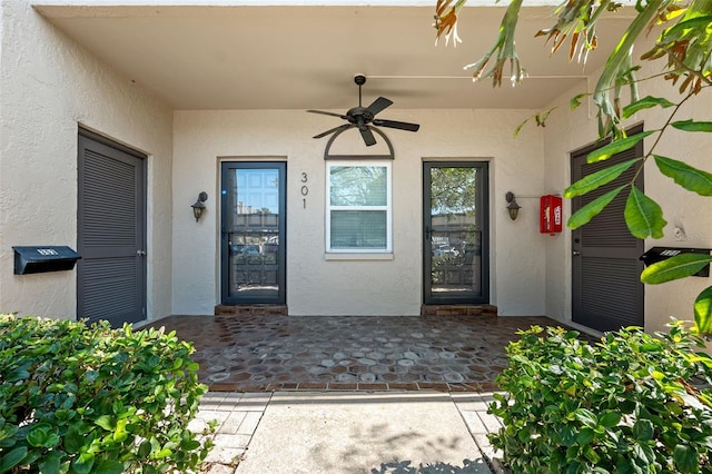 property entrance featuring ceiling fan and a patio area