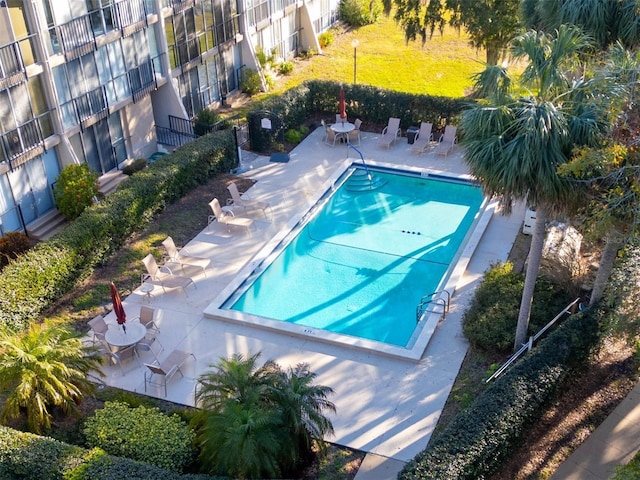 view of swimming pool with a patio area