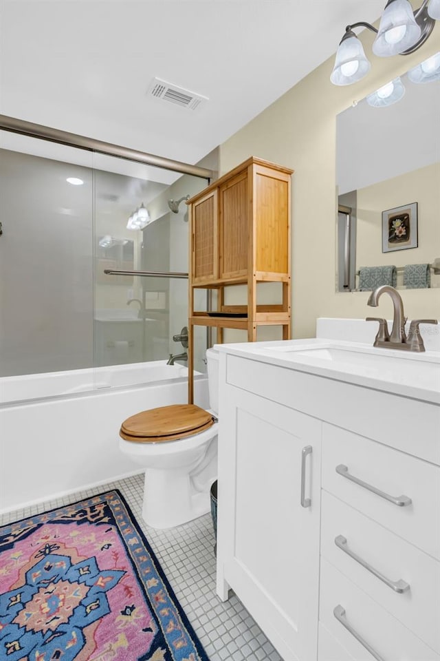 bathroom featuring shower / bath combination with glass door, visible vents, toilet, vanity, and tile patterned floors