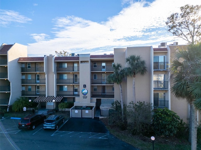 view of property with uncovered parking