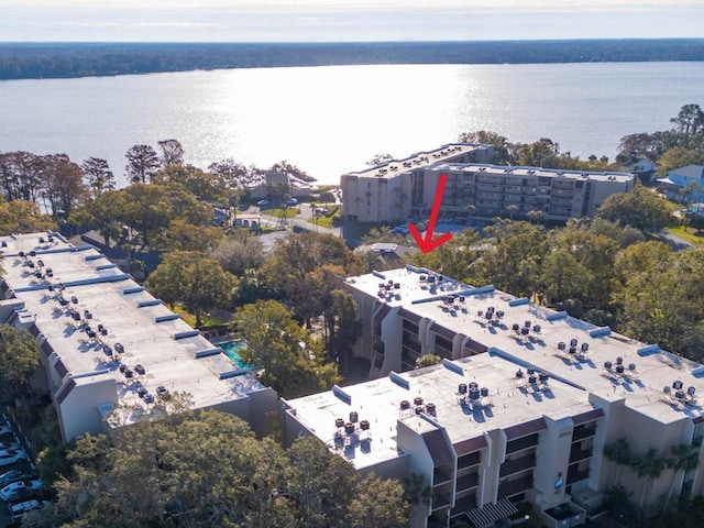 birds eye view of property with a water view