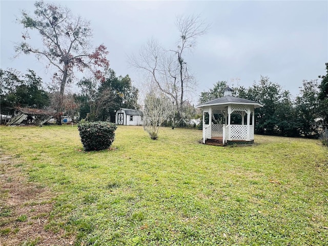 view of yard with a storage shed and a gazebo