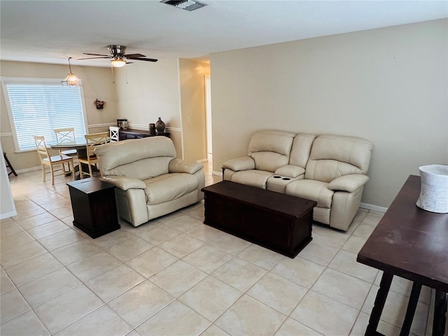 tiled living room featuring ceiling fan