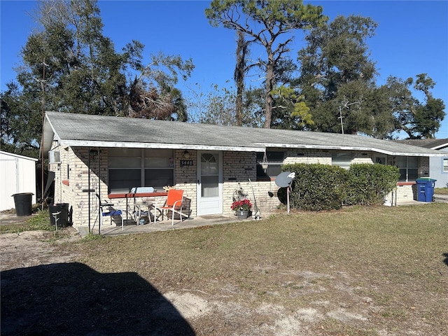 single story home featuring a patio area and a front yard