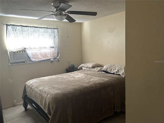 bedroom with cooling unit, a textured ceiling, ceiling fan, and light tile patterned floors