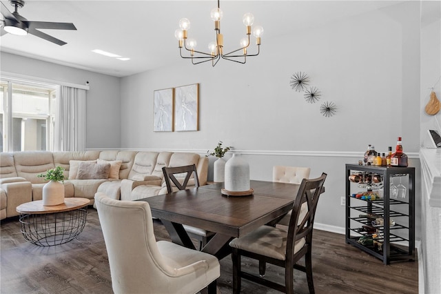 dining room with ceiling fan and dark hardwood / wood-style flooring