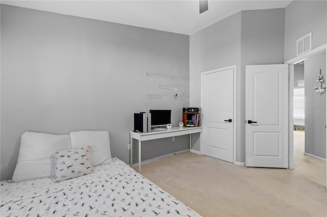 carpeted bedroom with ceiling fan