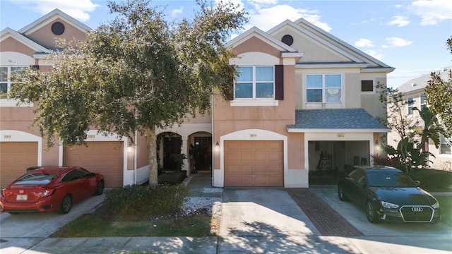 26614 Castleview Way, Wesley Chapel, FL 33544 - view of front facade with concrete driveway, stucco siding, and a garage