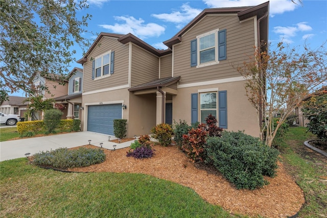 view of front of house featuring a garage and a front yard