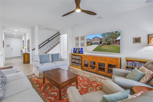 living room with light tile patterned floors and ceiling fan