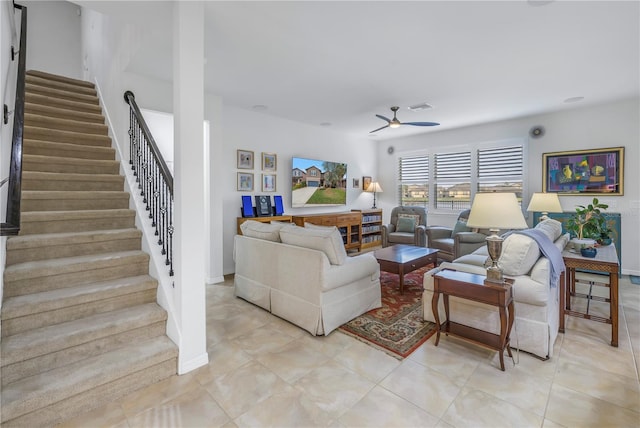 living room featuring ceiling fan and light tile patterned floors