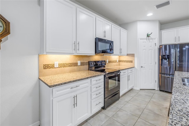 kitchen with white cabinetry, light stone countertops, and black appliances