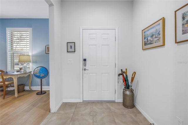 entrance foyer featuring light tile patterned floors