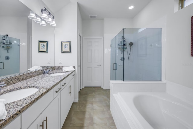 bathroom featuring tile patterned floors, separate shower and tub, and vanity