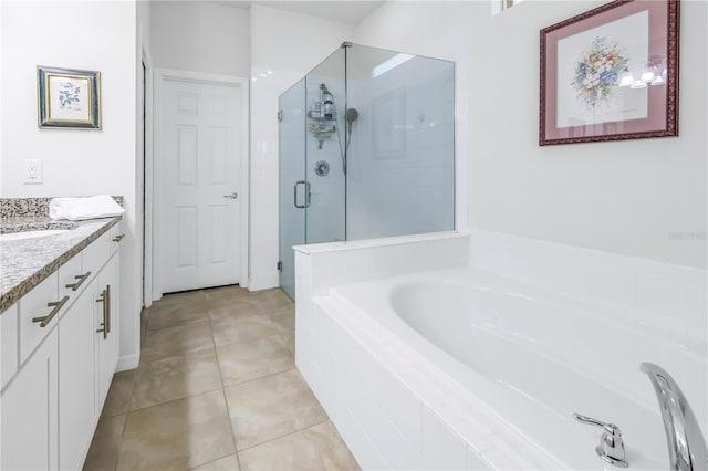 bathroom featuring tile patterned floors, vanity, and plus walk in shower