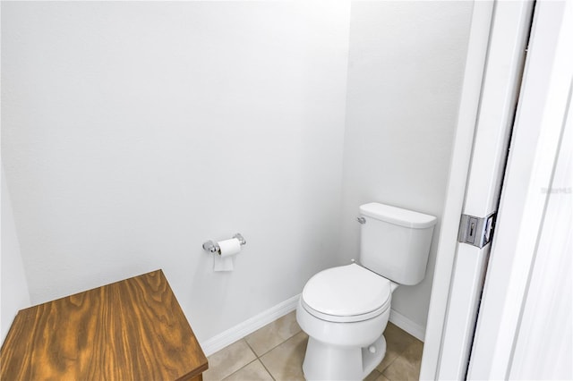 bathroom with tile patterned floors and toilet