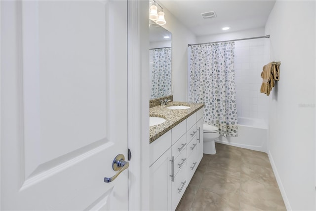 full bathroom featuring shower / tub combo with curtain, vanity, tile patterned floors, and toilet