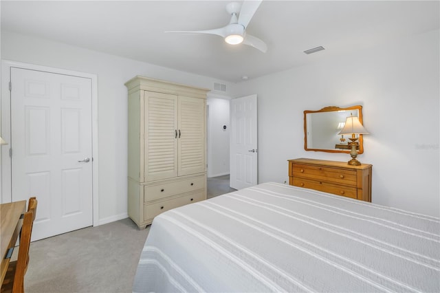 bedroom with ceiling fan and light colored carpet