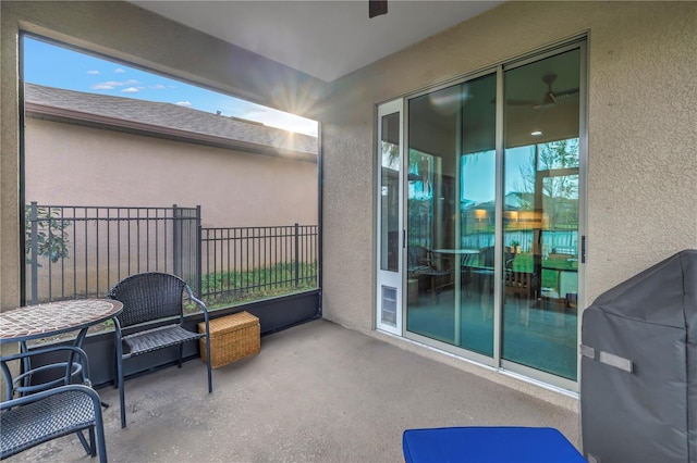 view of patio featuring area for grilling and a balcony