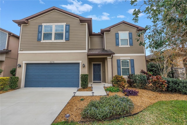 6216 Kevesta Ave, Palmetto, FL 34221 - traditional-style home with a garage, stucco siding, and concrete driveway
