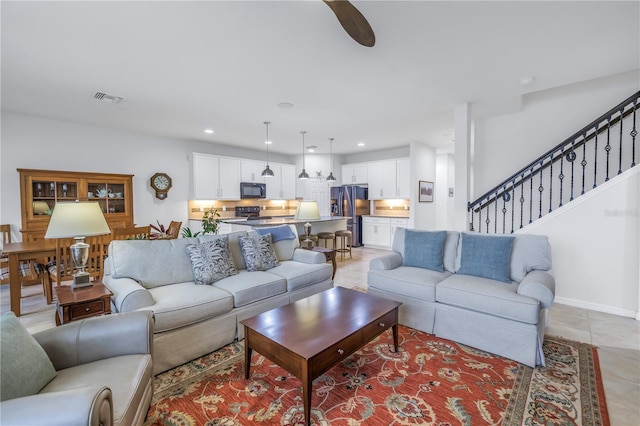 6216 Kevesta Ave, Palmetto, FL 34221 - living room featuring recessed lighting, stairs, and light tile patterned floors