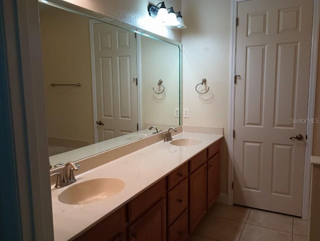 bathroom with vanity and tile patterned flooring