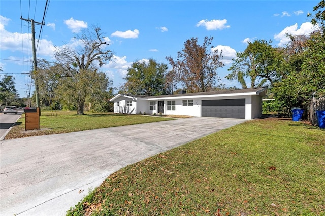 ranch-style house with a garage and a front yard