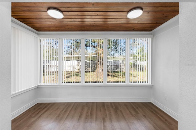 unfurnished sunroom featuring wooden ceiling