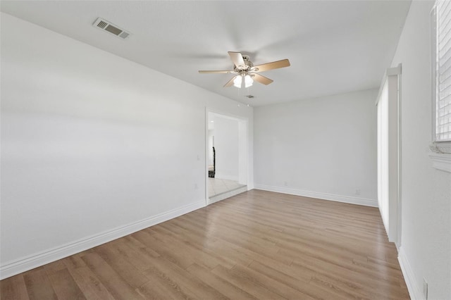 empty room featuring light hardwood / wood-style floors and ceiling fan