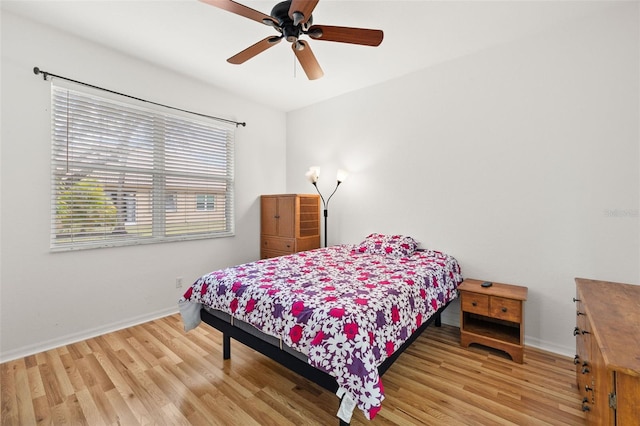 bedroom featuring ceiling fan and light wood-type flooring