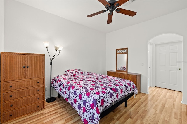 bedroom with ceiling fan and light hardwood / wood-style floors